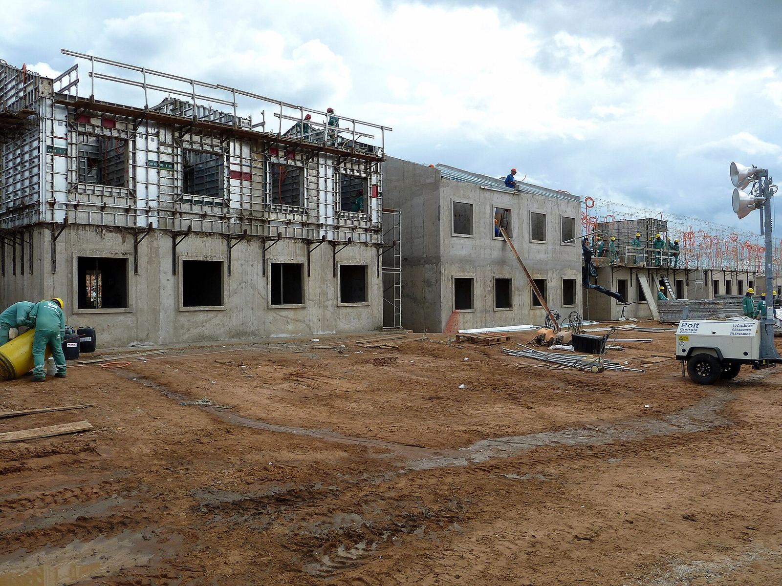 Representative image: walls rising in formwork on a building site